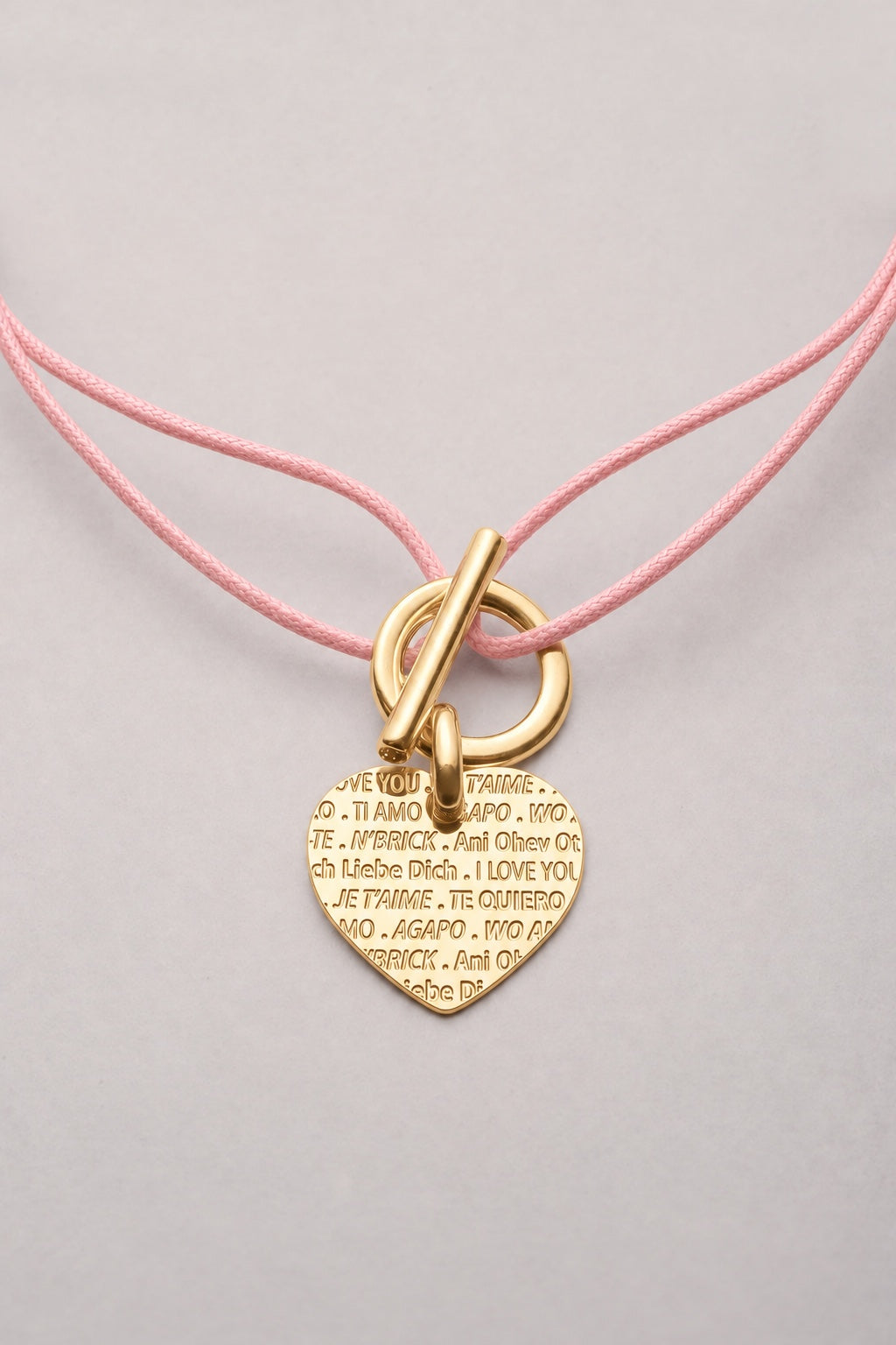 Collier attache cœur je t’aime doré, cordon rose pâle