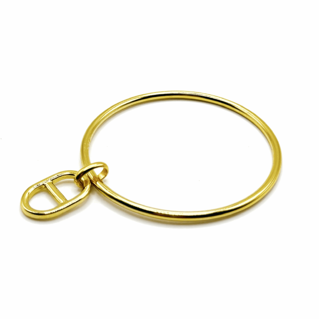 Jonc doré avec une jolie pampille maille marine dorée